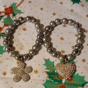 Elegant Silver Beaded Bracelets One With A Heart And One With A Flower